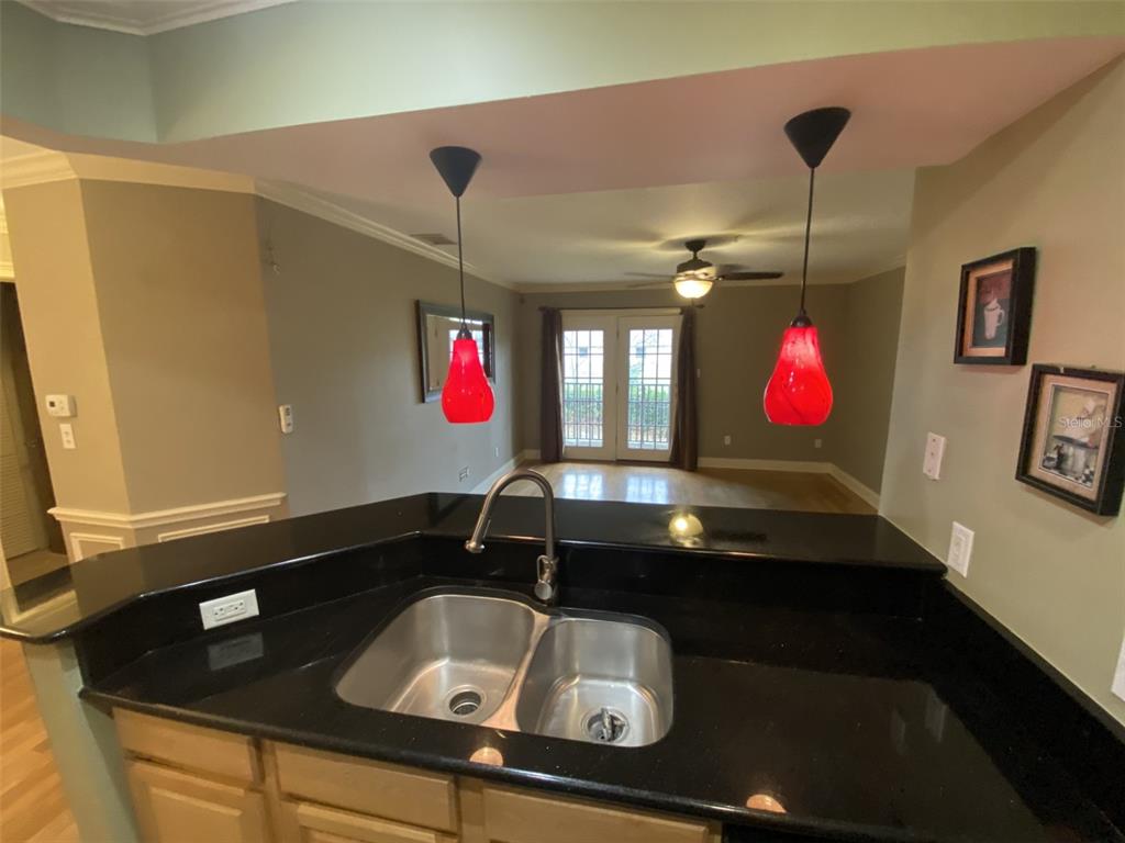 246 Afton Square, Unit 203 Altamonte Springs, FL 32714 - Photo 6 of 26 a bathroom with a sink and a mirror