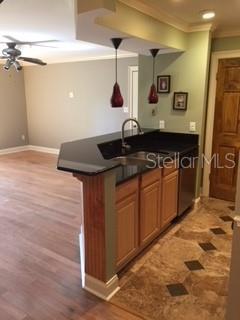 246 Afton Square, Unit 203 Altamonte Springs, FL 32714 - Photo 8 of 26 a kitchen with stainless steel appliances granite countertop a sink stove and cabinets