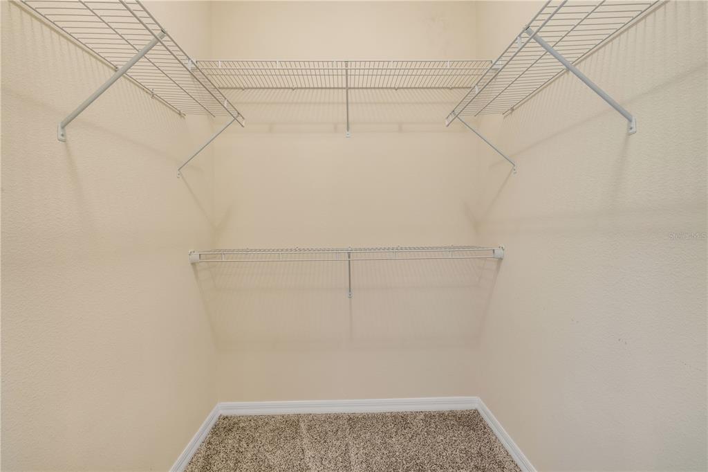 3329 Tuscano Avenue New Smyrna Beach, FL 32168 - Photo 14 of 36 a view of a room with racks on the wall