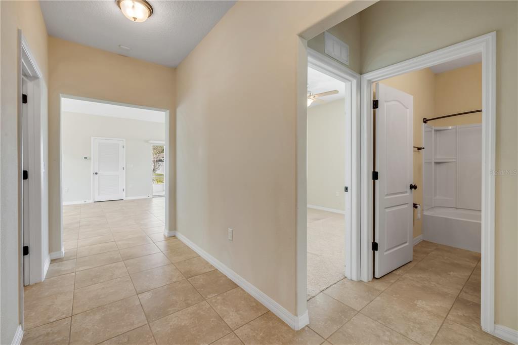 3329 Tuscano Avenue New Smyrna Beach, FL 32168 - Photo 15 of 36 a view of a hallway to rooms