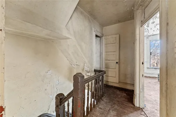 a view of a big room with windows