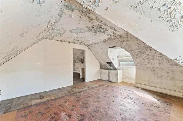 a view of a house with wooden fence