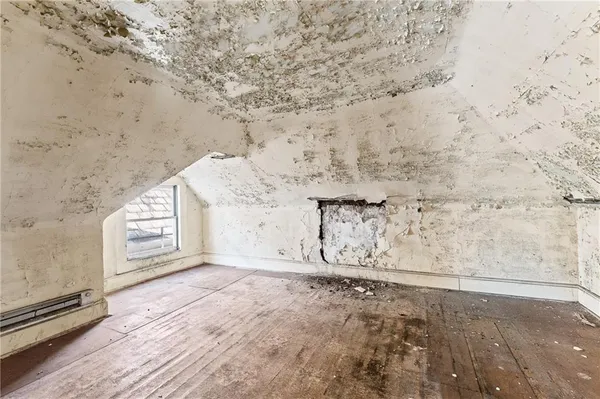 a view of residential houses with wooden fence