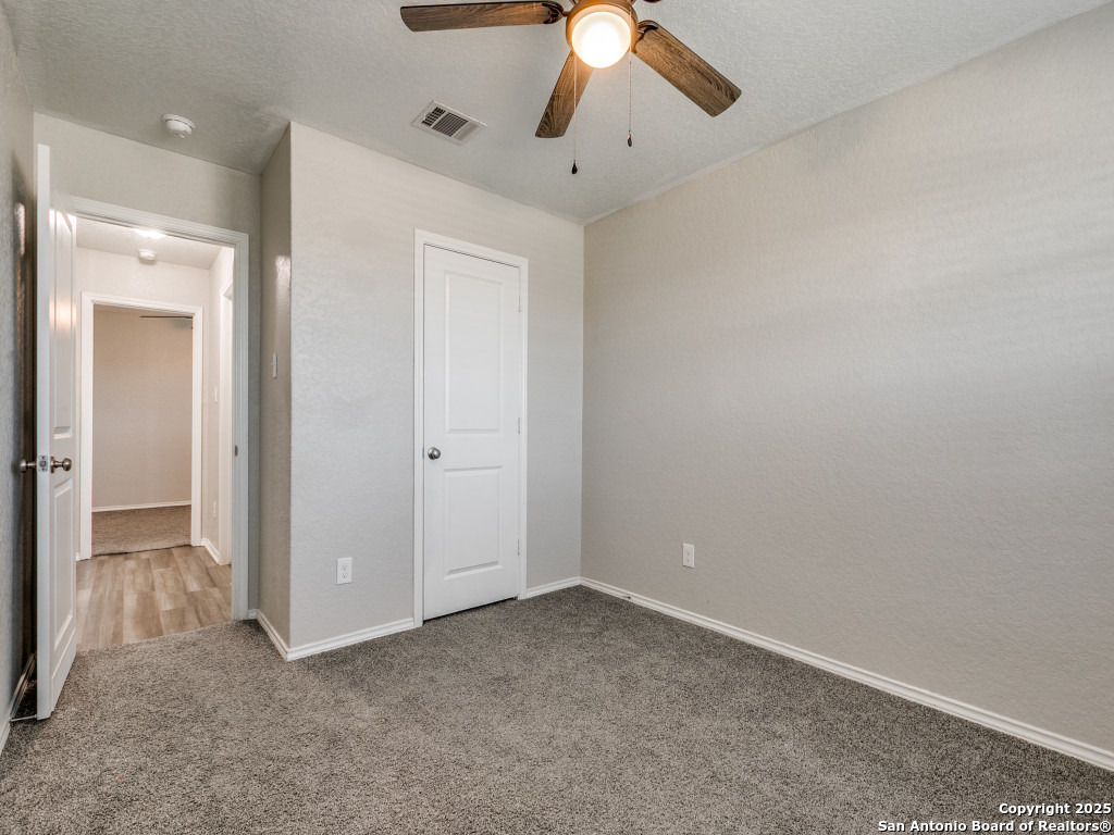 31593 Nimbus Drive Bulverde, TX 78163 - Photo 14 of 30 an empty room with chandelier fan