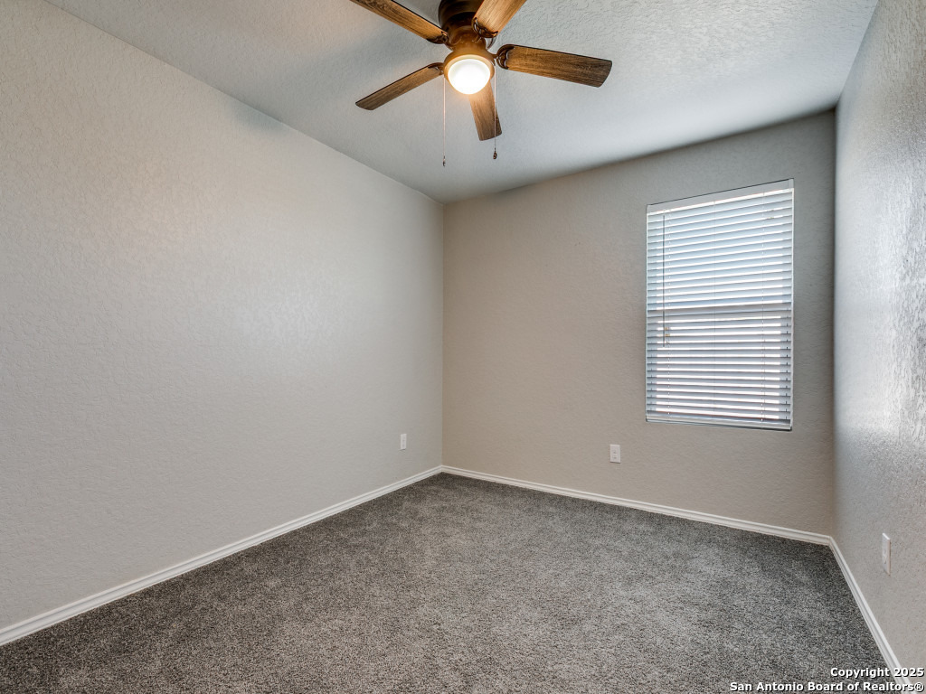 31593 Nimbus Drive Bulverde, TX 78163 - Photo 15 of 30 an empty room with a window and a fan