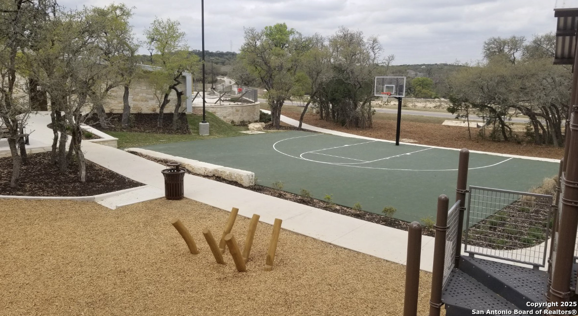 31593 Nimbus Drive Bulverde, TX 78163 - Photo 22 of 30 a view of a swimming pool with a bench