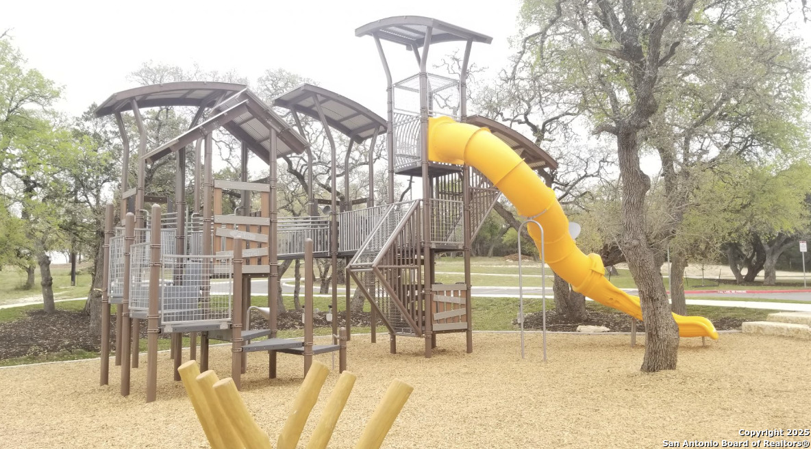 31593 Nimbus Drive Bulverde, TX 78163 - Photo 23 of 30 a view of residential houses with yard and swimming pool