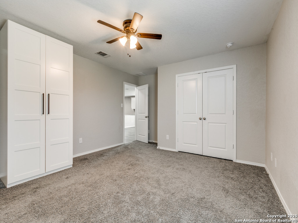 31593 Nimbus Drive Bulverde, TX 78163 - Photo 10 of 30 an empty room with chandelier fan