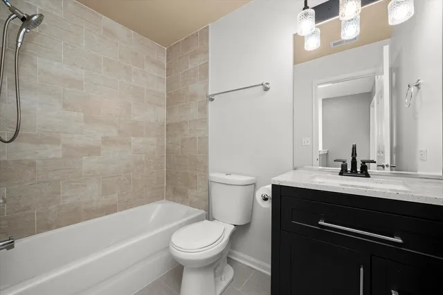 a bathroom with a sink a toilet and a bathtub