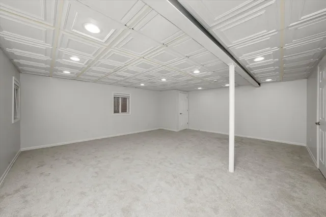 an empty room with a empty space and windows