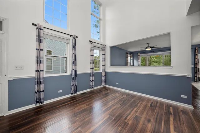 a view of a room with window wooden floor and cabinet