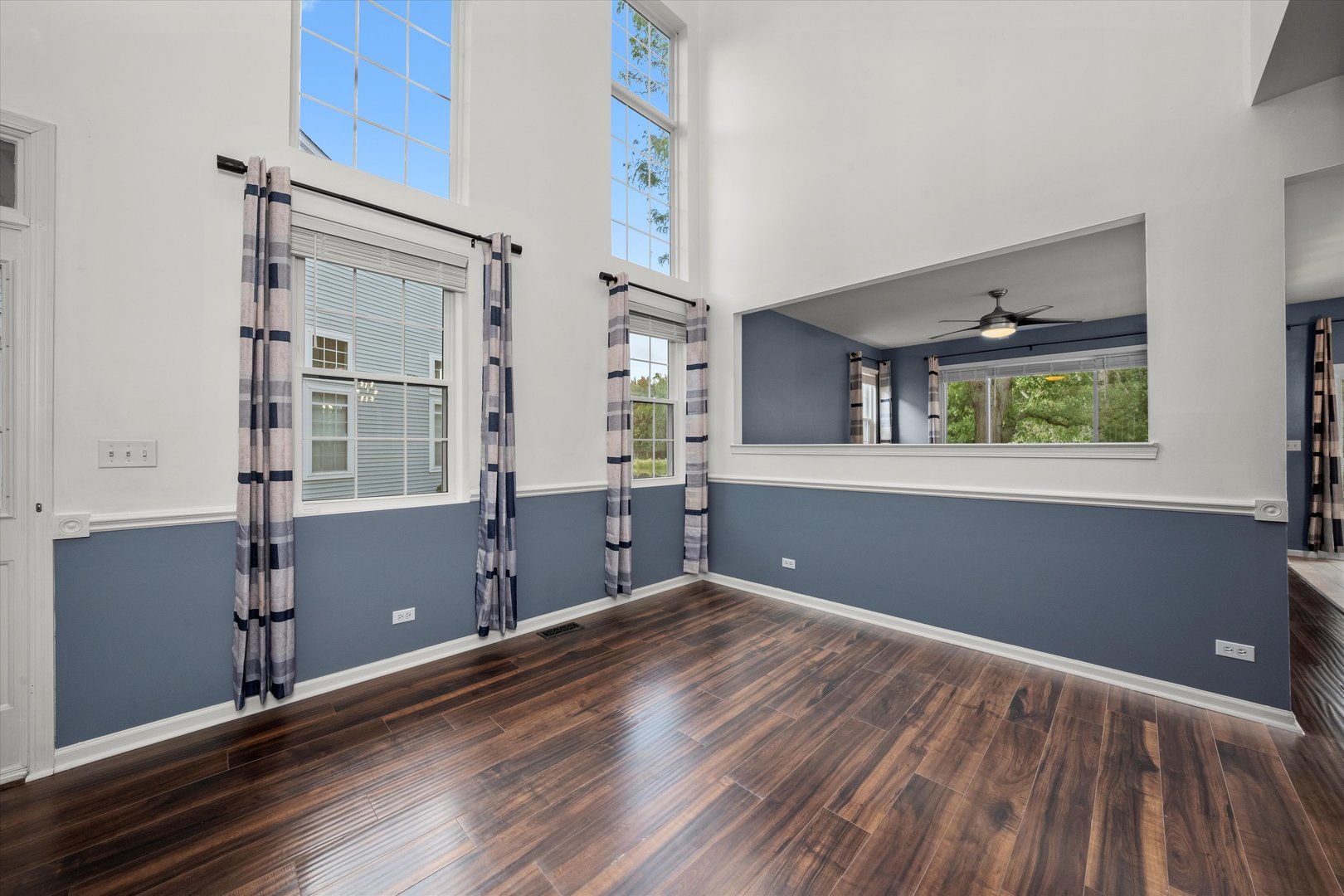 2468 Reflections Drive, Unit 2468 Aurora, IL 60502 - Photo 3 of 21 a view of a room with window wooden floor and cabinet