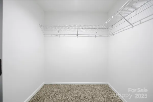 an empty room with fan and a ceiling fan