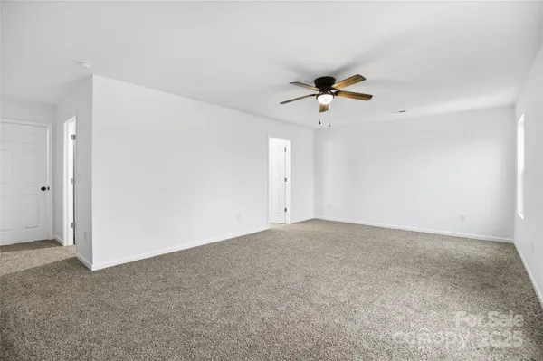 a bathroom with double vanity sink and a mirror
