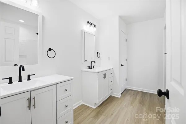 a bathroom with a bathtub and shower