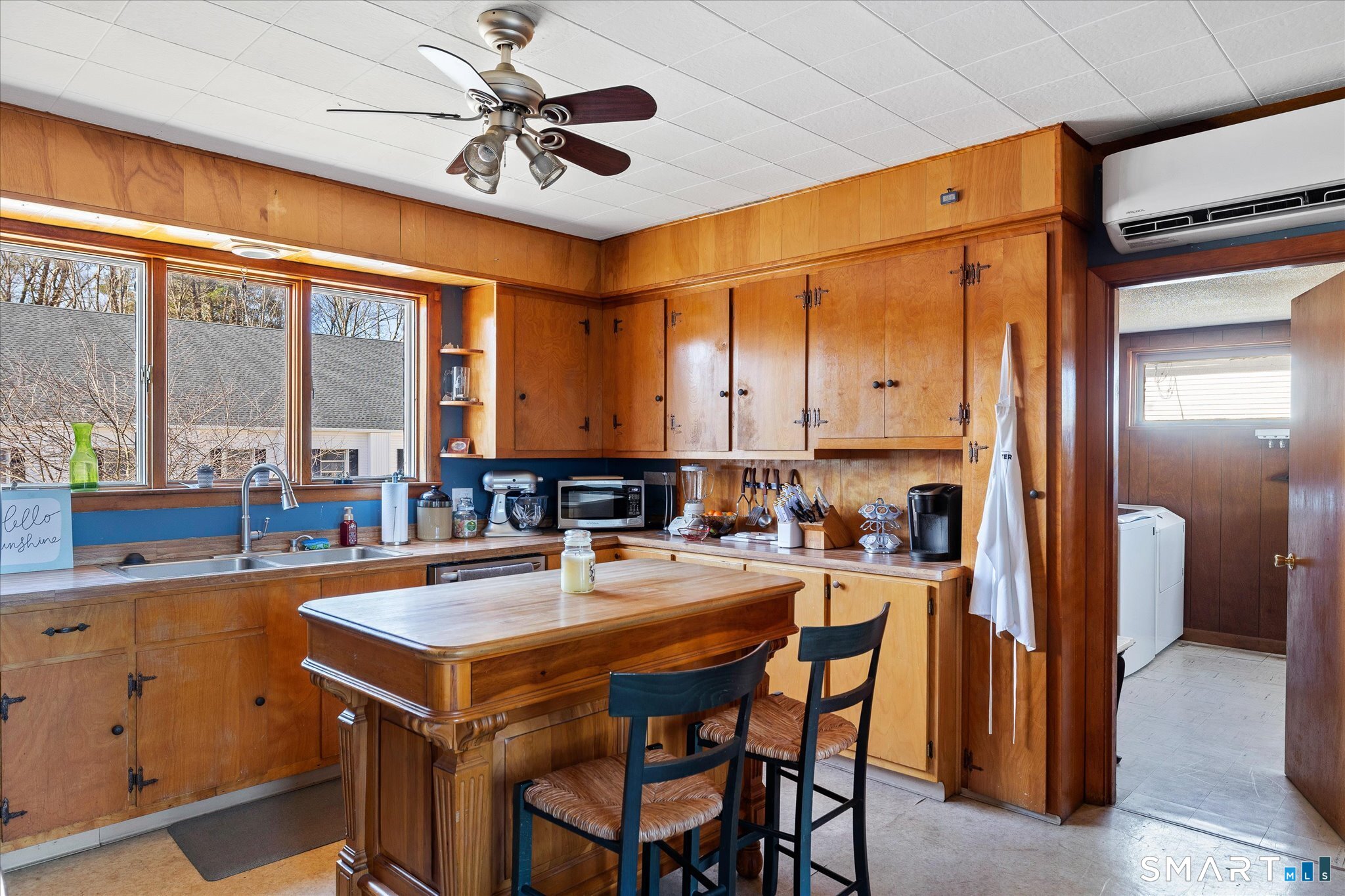 350 Hartford Pike Killingly, CT 06241 - Photo 5 of 32 a kitchen with a sink a refrigerator and chairs