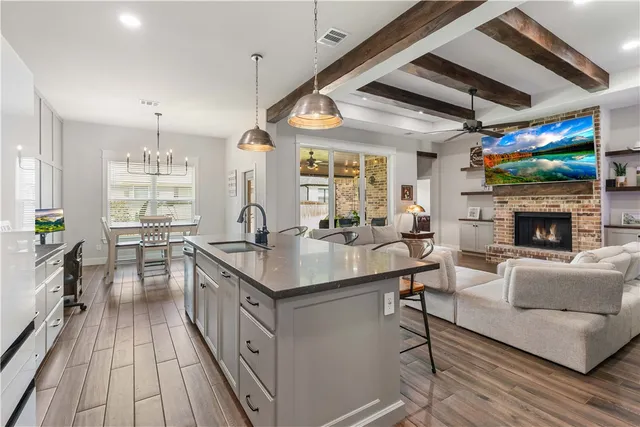 a kitchen with sink stove and cabinets