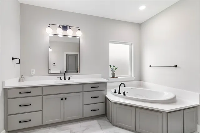 a bathroom with a double vanity sink mirror and