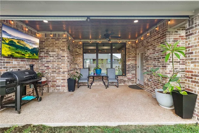 a view of a chairs and table in a patio
