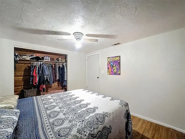 a bedroom with a bed and dresser