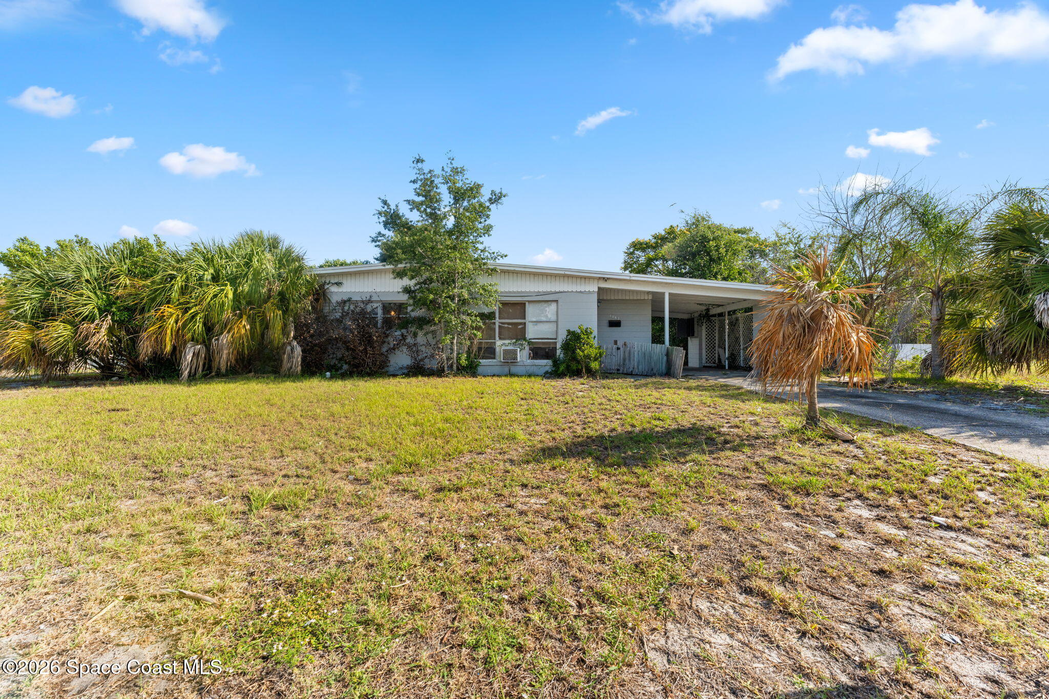 1042 Azalea Lane Cocoa, FL 32922 - Photo 2 of 26 a view of house with garden space