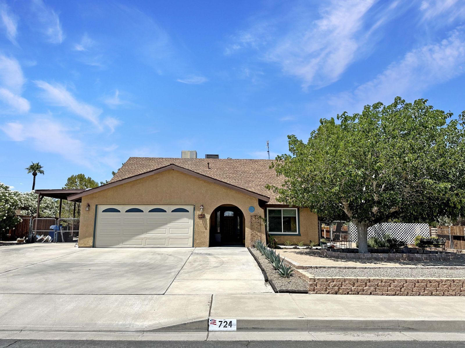 724 West Dolphin Avenue Ridgecrest, CA 93555 - Photo 1 of 50 a front view of a house with a yard