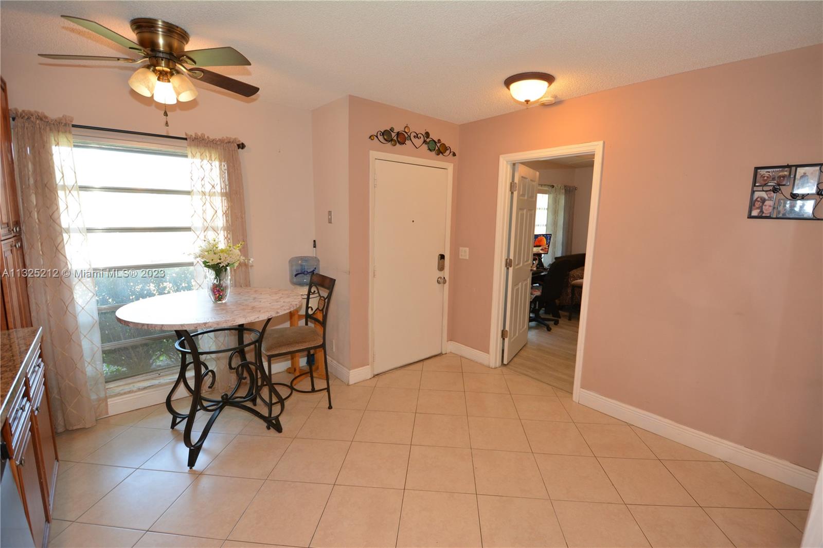 8936 Belle Aire Court, Unit 375 Boca Raton, FL 33433 - Photo 7 of 32 a view of a livingroom with furniture and a chandelier