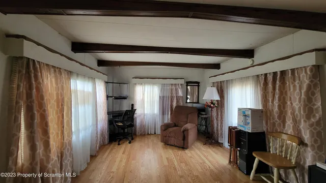 a view of livingroom with furniture and staircase