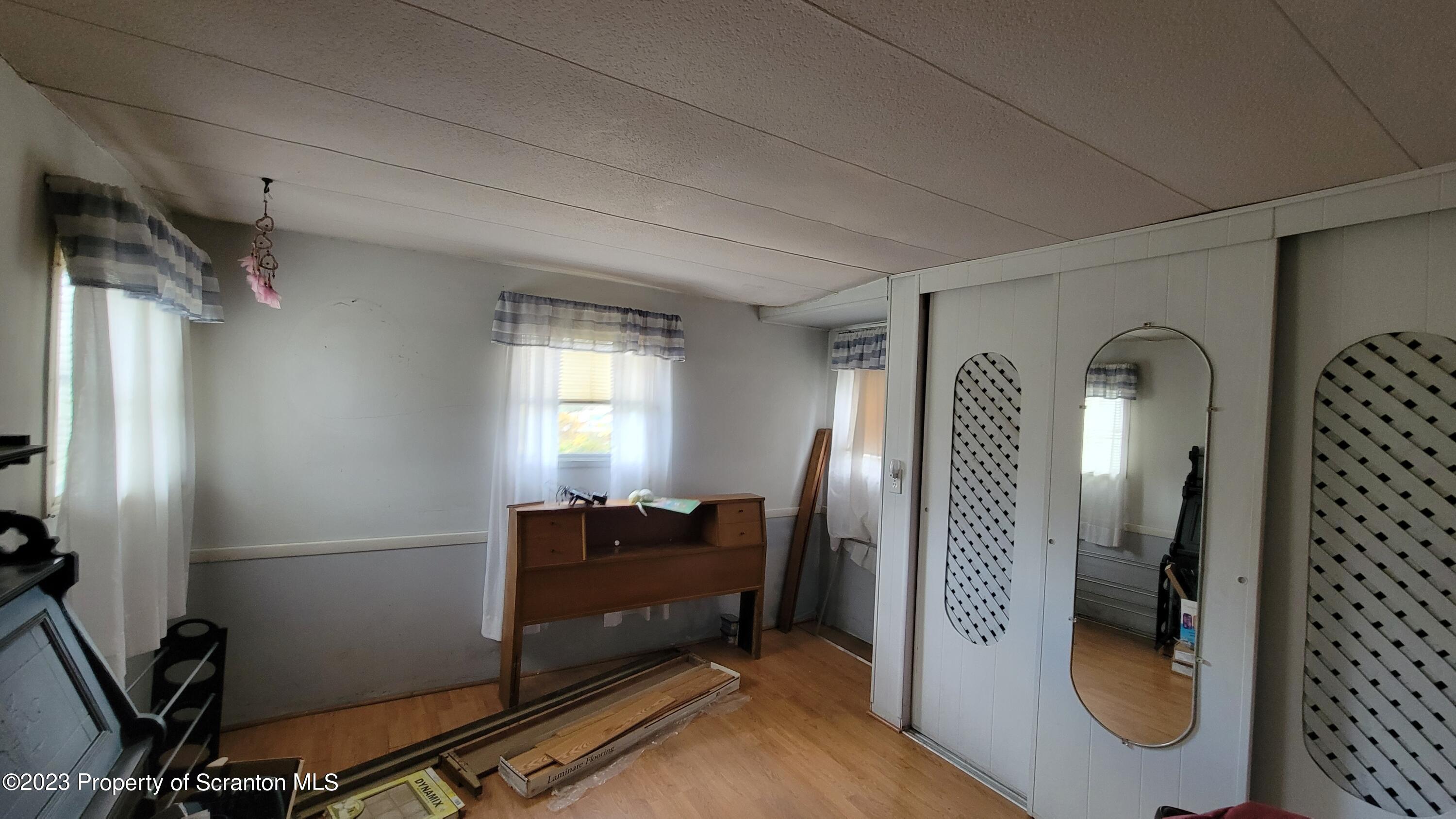 64 Franklin Street Great Bend, PA 18821 - Photo 14 of 17 a view of a hallway with workspace and a mirror