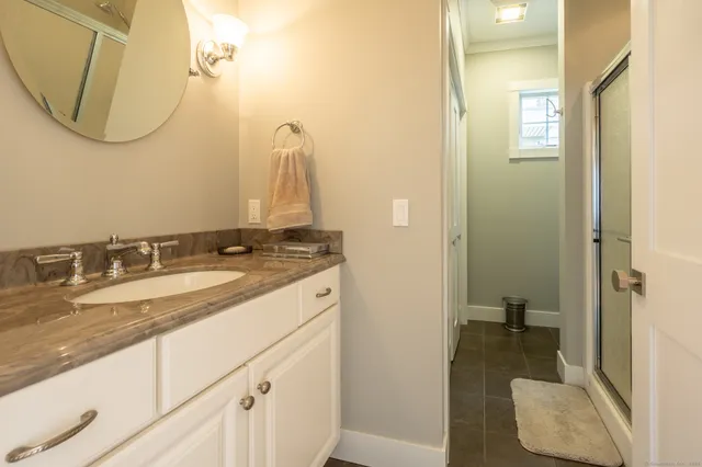 a bathroom with a sink and a mirror
