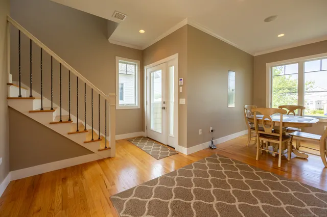 a view of a livingroom with furniture and windows