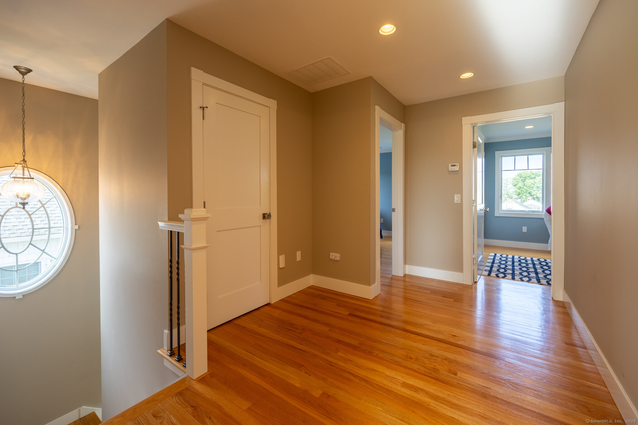 7 Saye Street Old Saybrook, CT 06475 - Photo 14 of 29 a view of a hallway with wooden floor