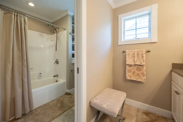 a bathroom with a shower and a toilet