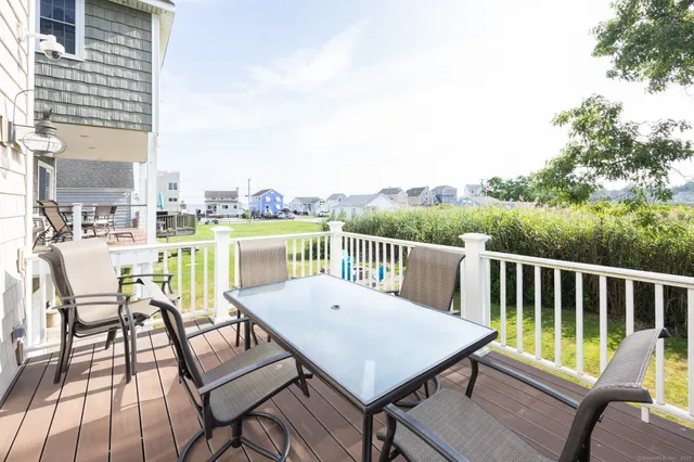 a view of a balcony with mountain view and wooden floor
