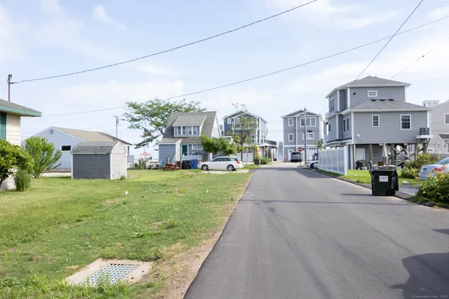 a view of building with cars parked