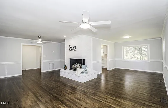 an white room with wooden floor and white walls