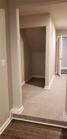 an empty room with wooden floor