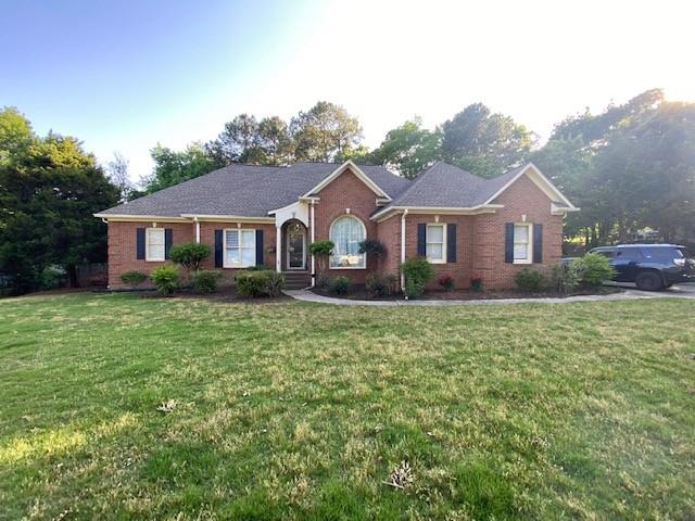 118 Warwick Way Southeast Rome, GA 30161 - Photo 1 of 1 a front view of a house with a garden