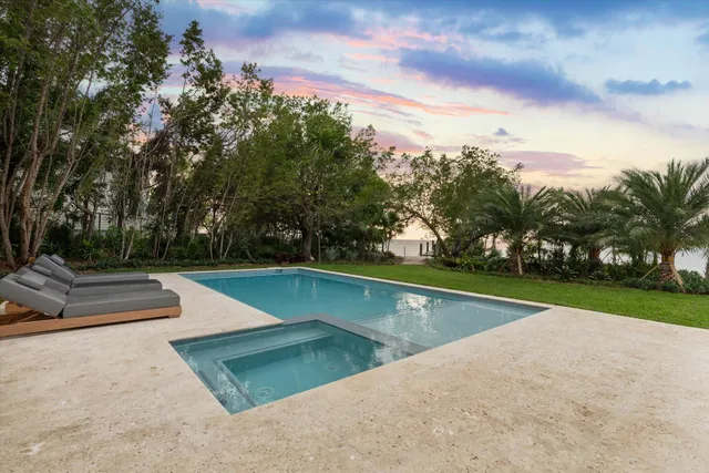 a bathroom with a sink a toilet and a shower