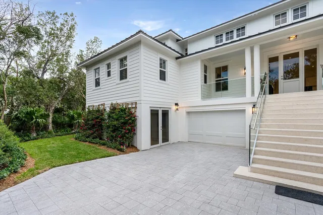 a spacious bedroom with a bed and a flat screen tv