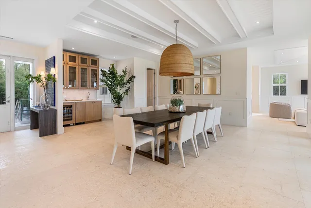 a bedroom with two beds and a large window