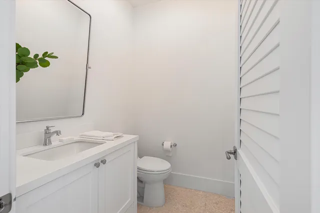 a view of a chairs with table in the back yard