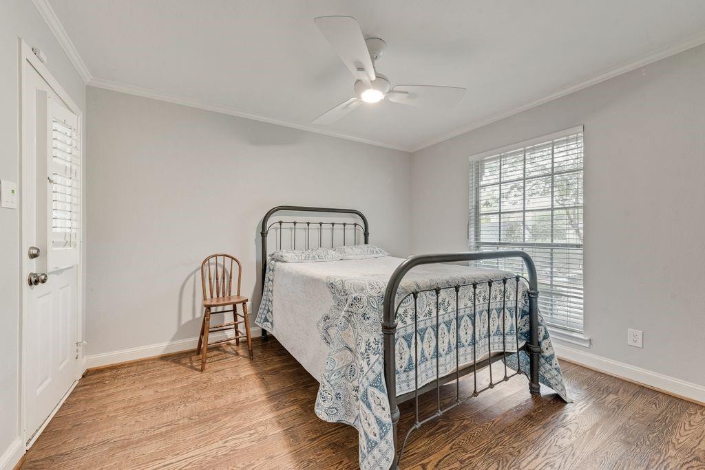 2 Eastshore Road Heath, TX 75032 - Photo 8 of 30 a bedroom with a bed and a window