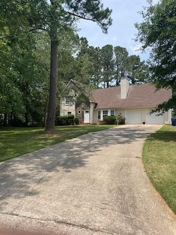 4706 Jay Bird Lane Powder Springs, GA 30127 - Photo 1 of 1 a house with yard in front of it