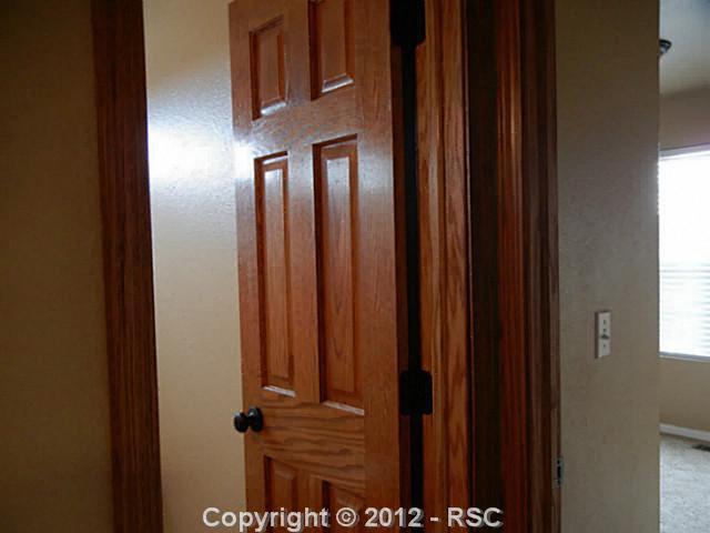 8121 Fort Smith Road Peyton, CO 80831 - Photo 13 of 17 SOLID WOOD 6 PANEL DOORS