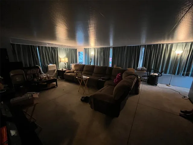 a media room with lots of chairs and a projector