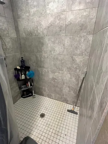 a bathroom with a sink and a shower