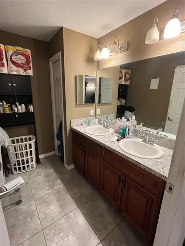 a bathroom with a sink a vanity and a mirror