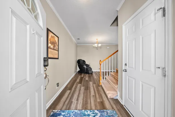 a view of entryway with wooden floor