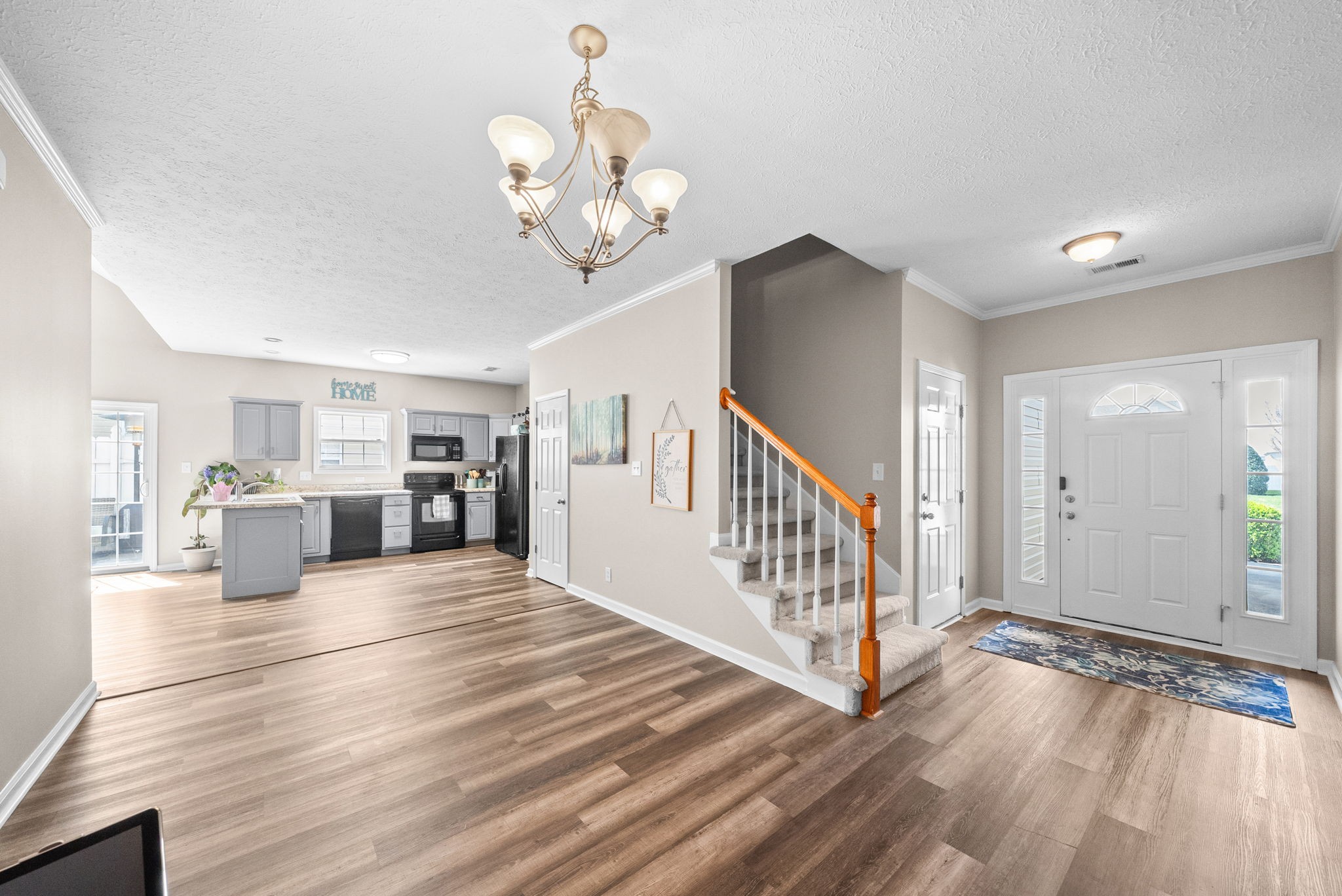 3737 Meadow Ridge Lane Clarksville, TN 37040 - Photo 3 of 32 a view of a room with wooden floor and staircase